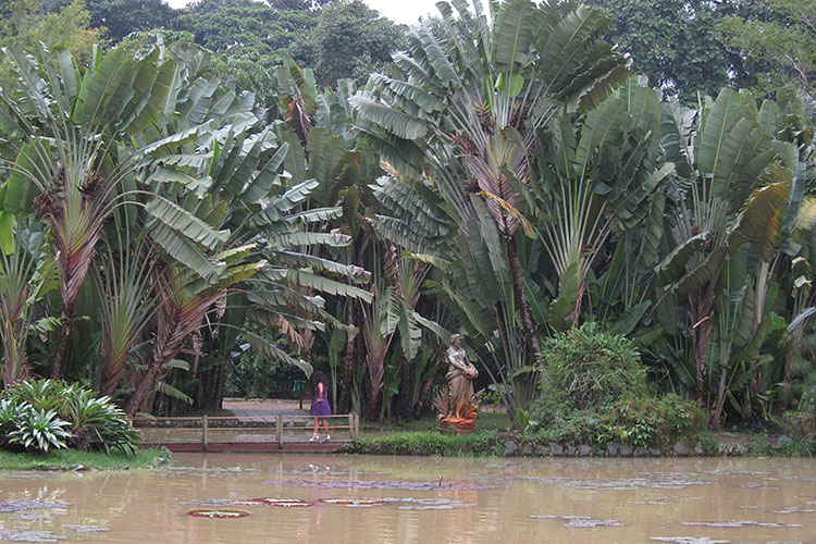 [Woman, Statue, and Lake]